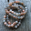 Bracelet 8mm matte moonstone with rose gold Buddha bead